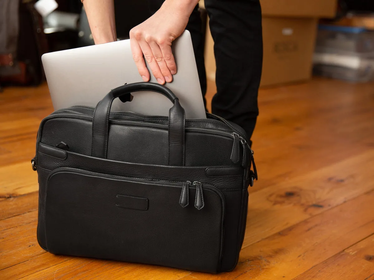 Close detail of Bosca Nappa Soft leather grain on the double zip laptop brief