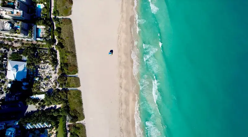 How far Orlando is from Miami with an aerial view of the Miami Beach coastline