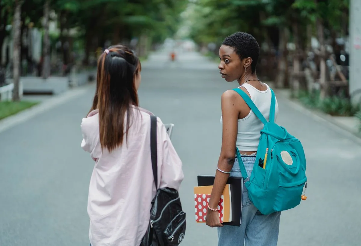 Graduate full-time credit hours with students carrying backpacks