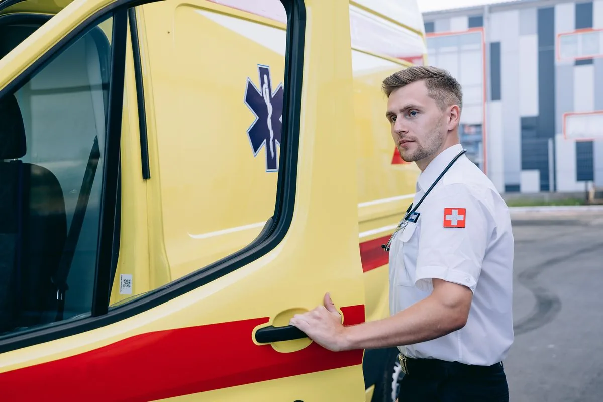 EMT versus paramedic pay with a uniformed medic at an ambulance