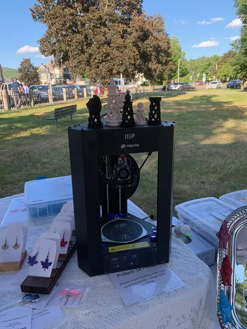 Close view of a 3D printer hotend depositing filament during a print
