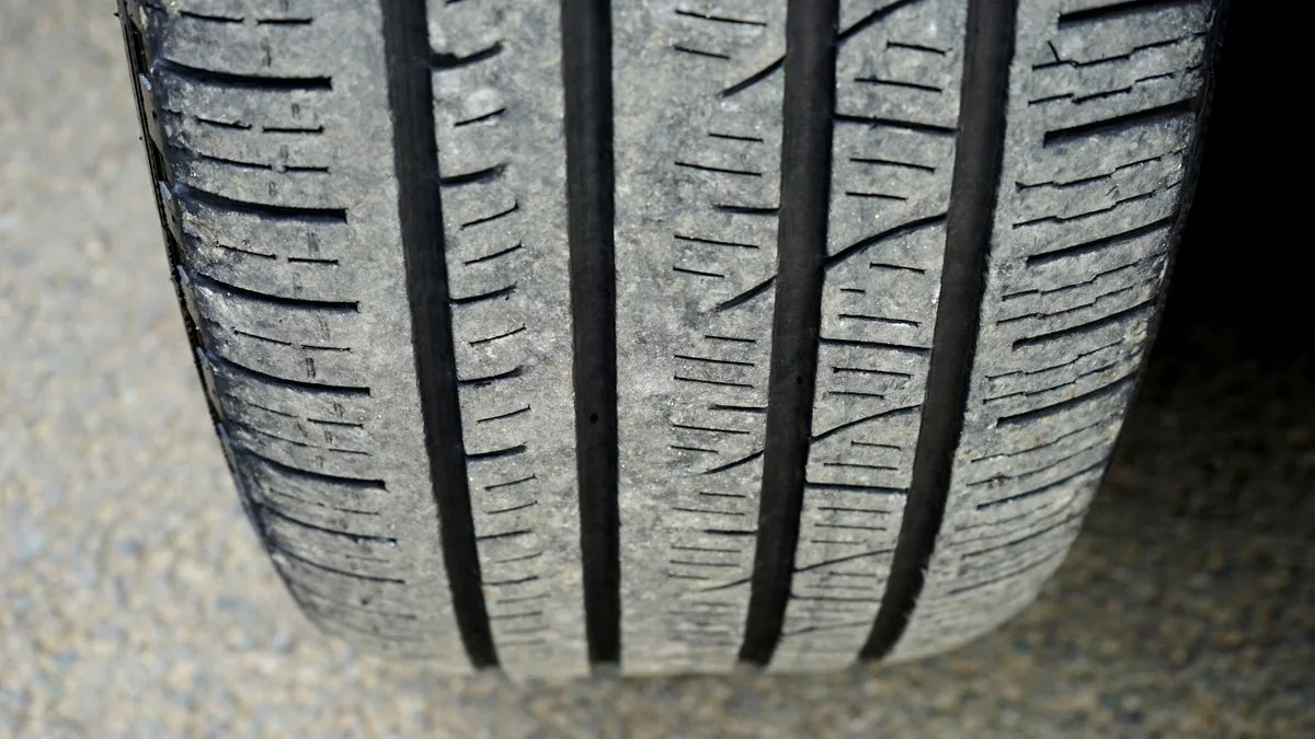 How to check tire tread on a worn car tire close-up