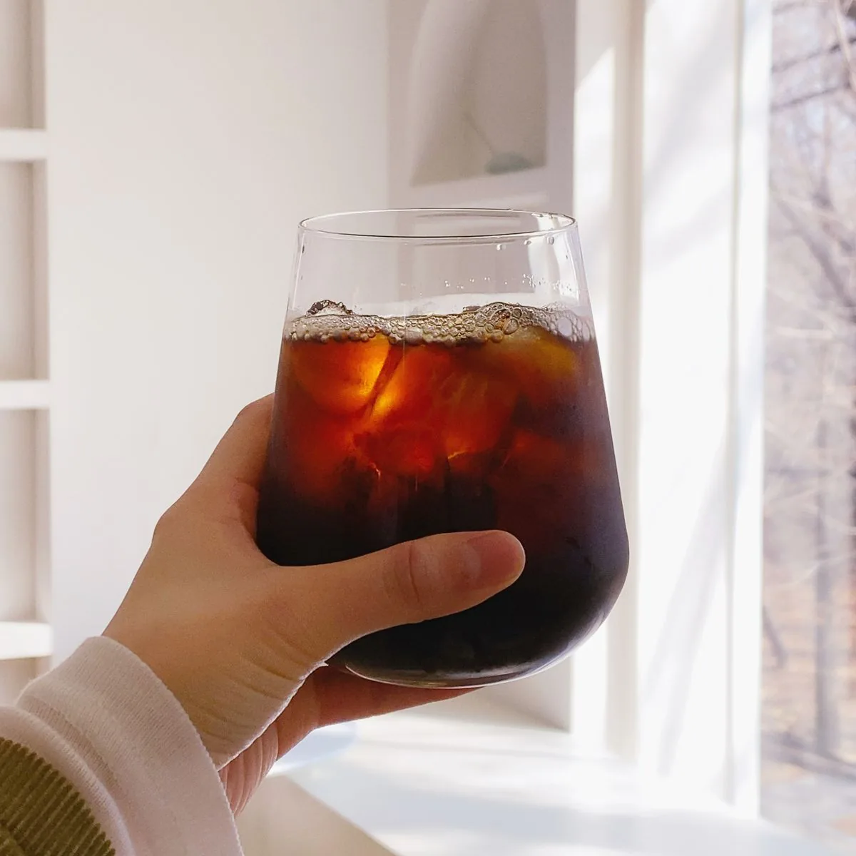 How to make cold foam topping over iced coffee in a tall glass