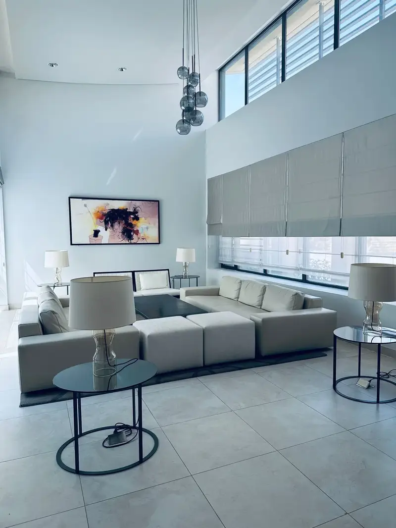 Modern living room with large windows showing floor-length curtain fit