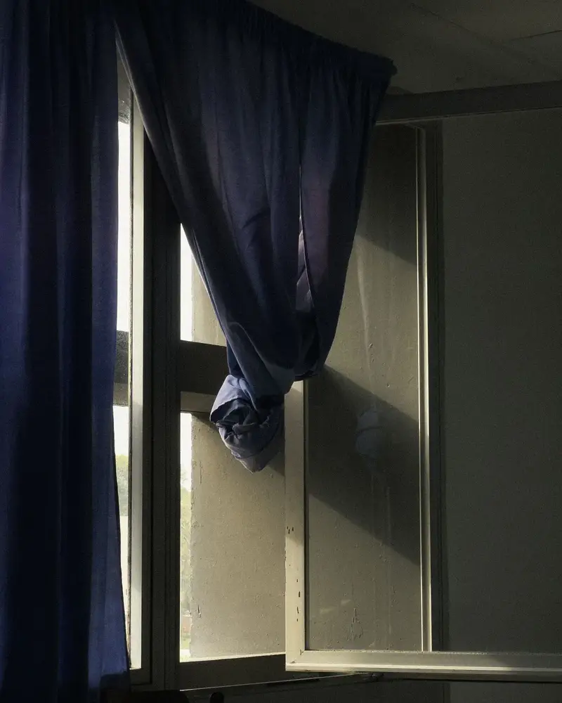 How to measure for curtains at an open window with blue curtains