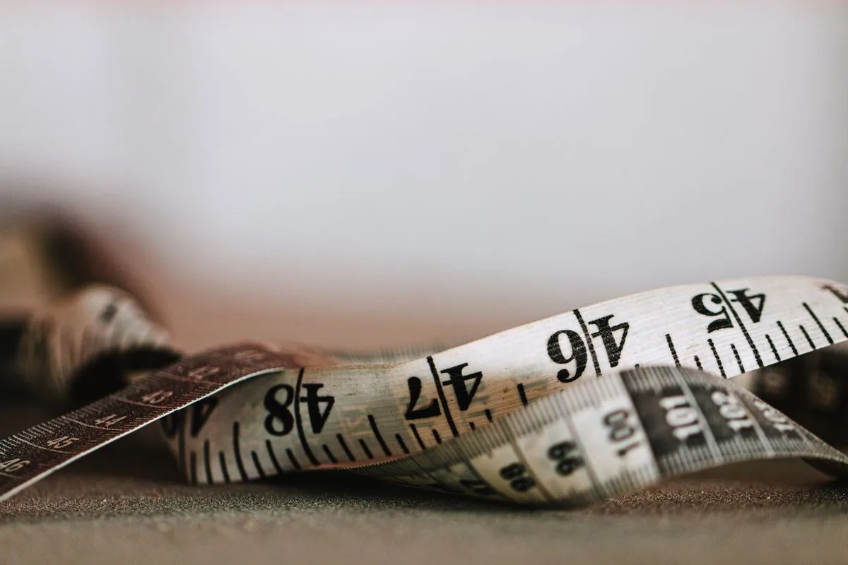 How to measure inseam with a flexible tape showing inches and centimeters