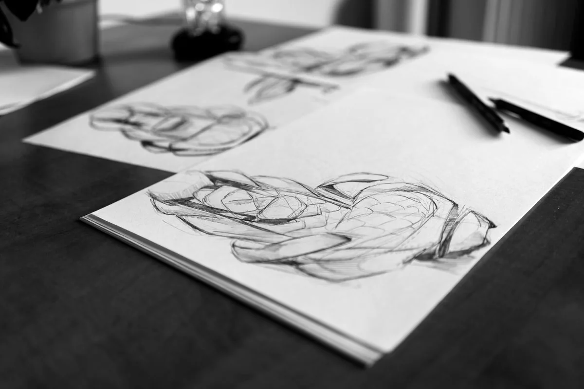 Step by step drawing ideas for beginners with sketches and pencils on a desk