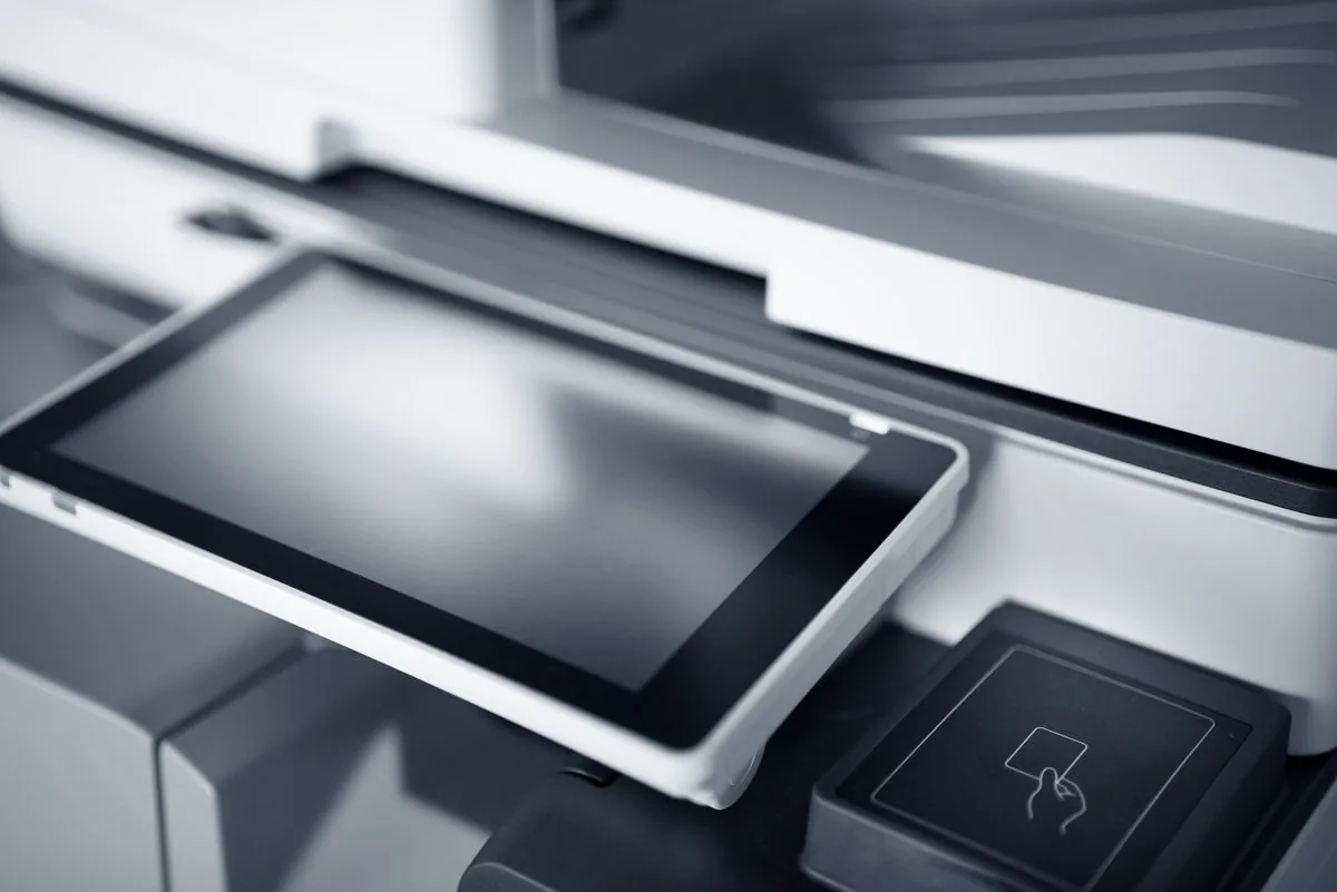 Close-up of an office printer touchscreen where copy and collate settings live