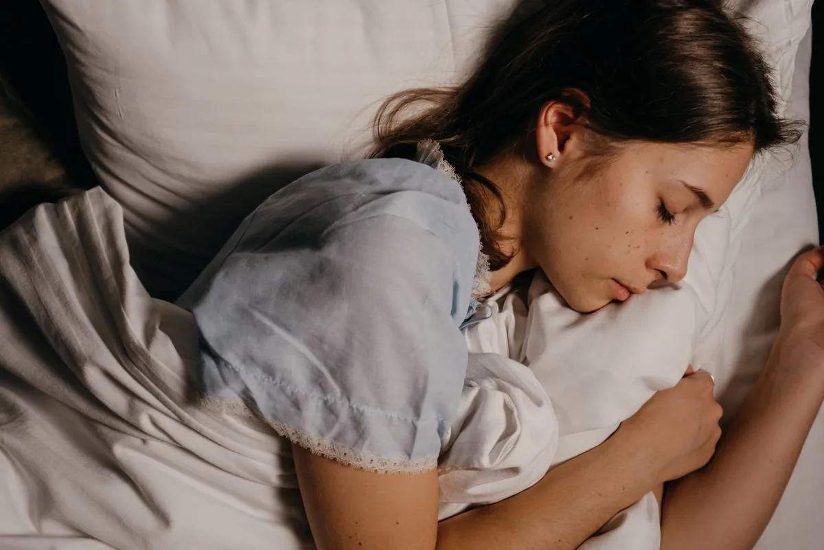 What it means when you dream about someone explained with a woman sleeping peacefully