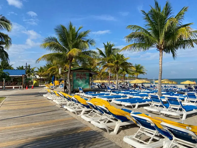 Palm beach with loungers in Belize where is belize mainland coast near San Pedro