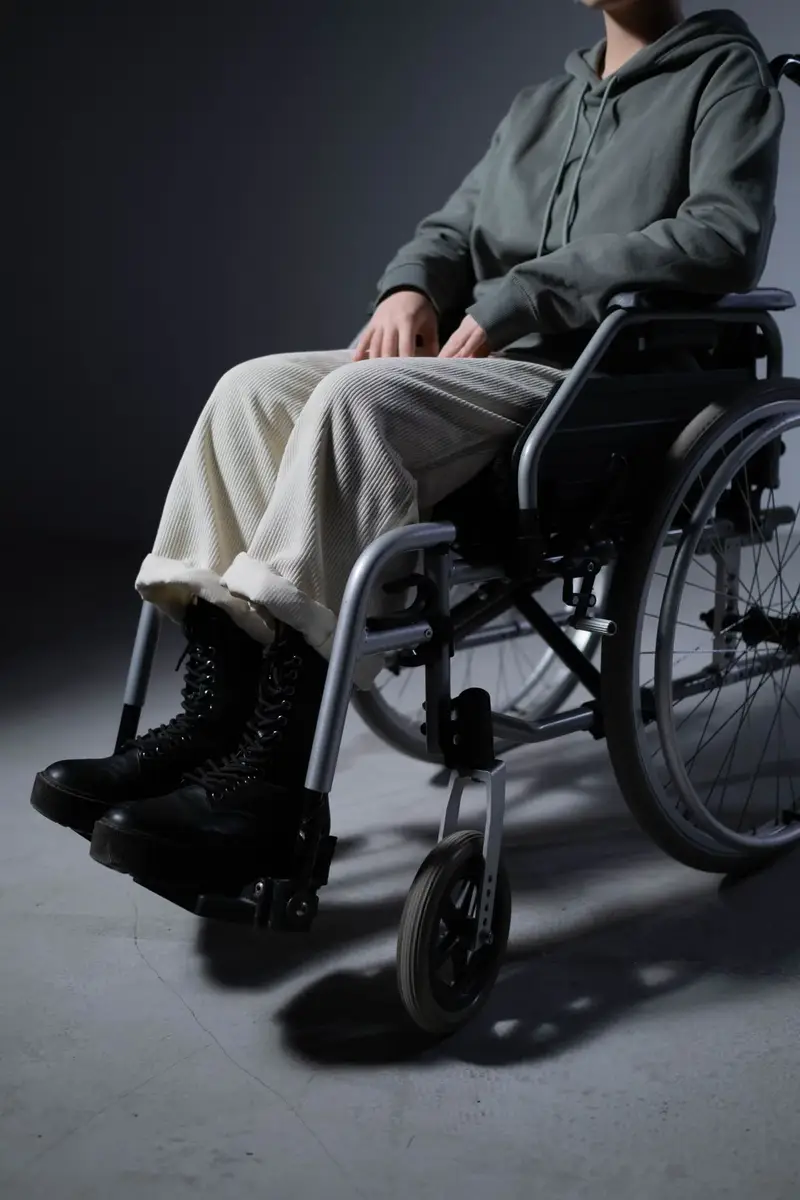 Person seated in a wheelchair indoors showing mobility donations for where to donate medical equipment